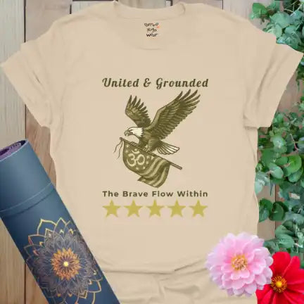 Neutral sand color tee with vintage camo eagle and The Brave Flow Within slogan — calm and earthy.