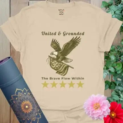 Neutral sand color tee with vintage camo eagle and The Brave Flow Within slogan — calm and earthy.