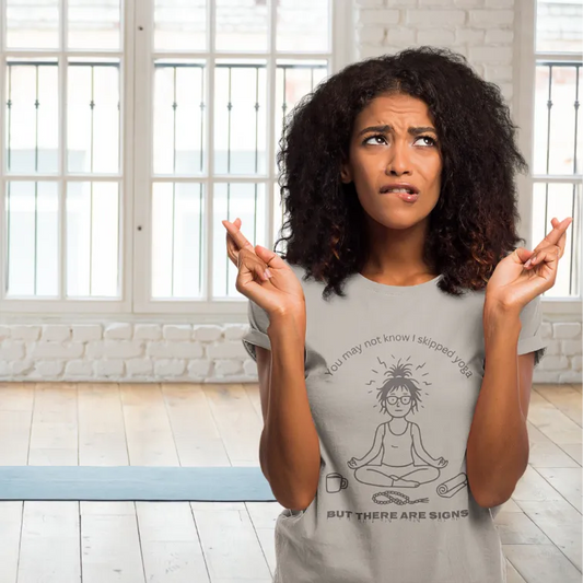 Woman wearing Signs T-Shirt Ice Grey sacred yoga shirt indoors in a sunlit room — The Vault collection by Ramro Yoga Wear