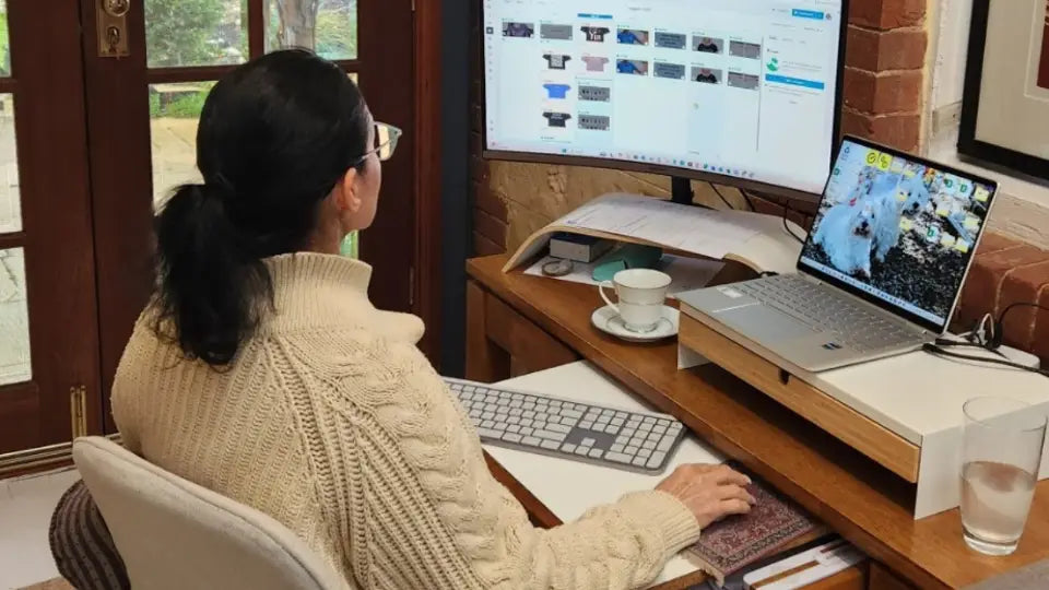 Connie from Ramro Yoga Wear working at her home desk in the early morning, scheduling the brand’s social media calendar. A candid behind-the-scenes look at the dedication and personal touch behind this small, family-run business