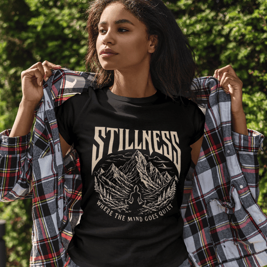 Ramro Yoga Wear Stillness tee in Black — mountain meditation vintage design, outdoor garden lifestyle shot