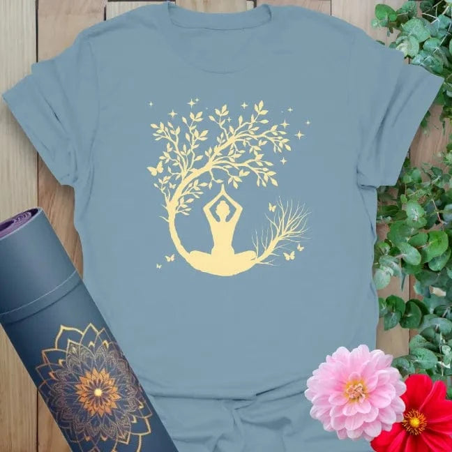 Muted stone blue yoga t-shirt with twilight meditation artwork and blossoming tree symbolizing calm and transformation.