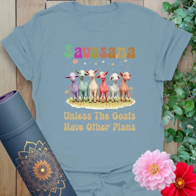 Muted stone blue yoga t-shirt featuring fun goat lineup and "Savasana" humor perfect for lighthearted yogis.