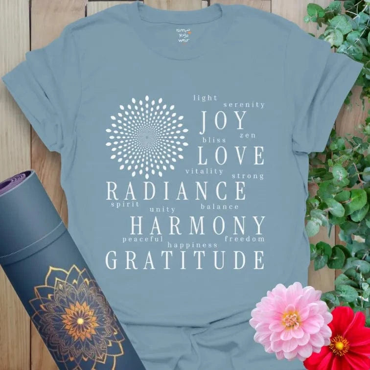 Stone blue gratitude shirt with positive word art including joy, harmony, and love.