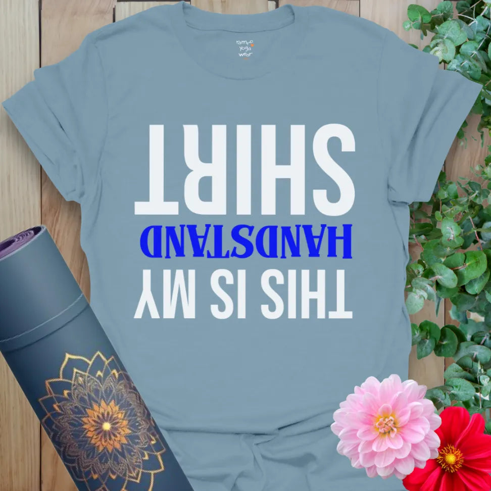 Muted stone blue yoga t-shirt featuring upside-down yoga humor design inspiring joyful, mindful expression.