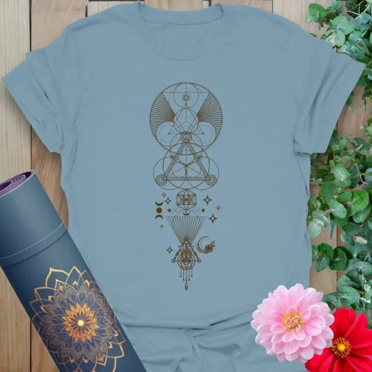Muted stone blue yoga t-shirt featuring celestial sacred geometry artwork inspiring conscious, soulful movement.