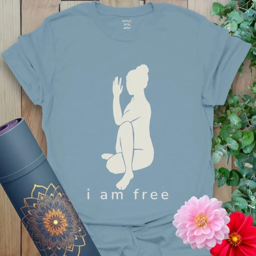 Stone Blue I Am Free T-Shirt with spiritual affirmation “I Am Free” beneath yoga pose silhouette. Everyday yoga wear for inner peace and strength.