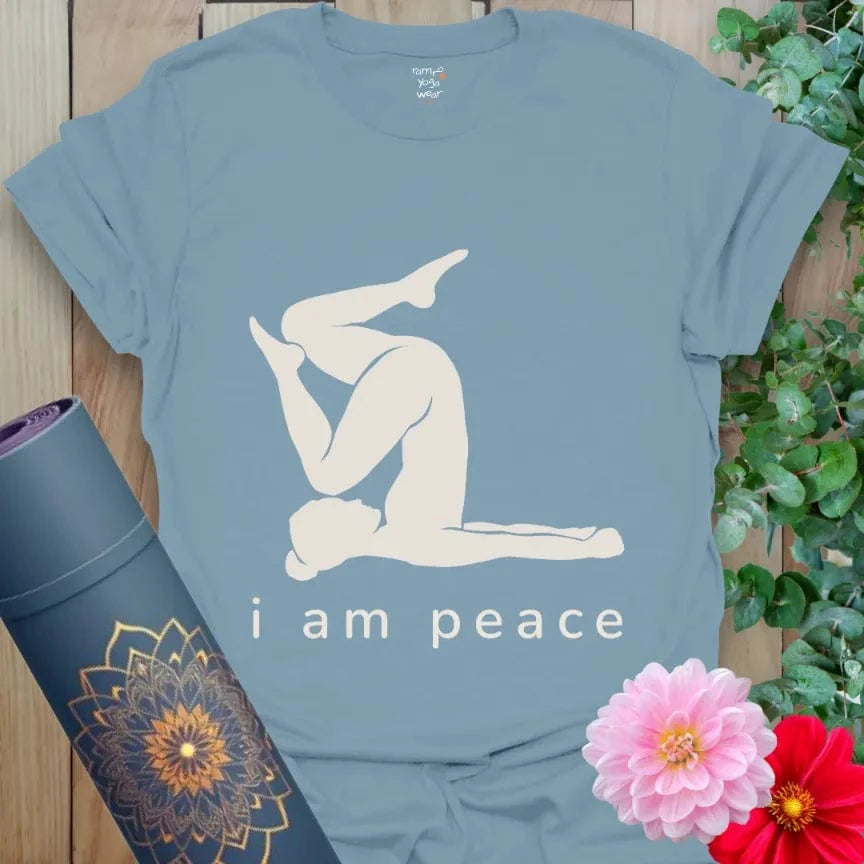 Stone Blue tee featuring a white yoga silhouette with text "i am peace."