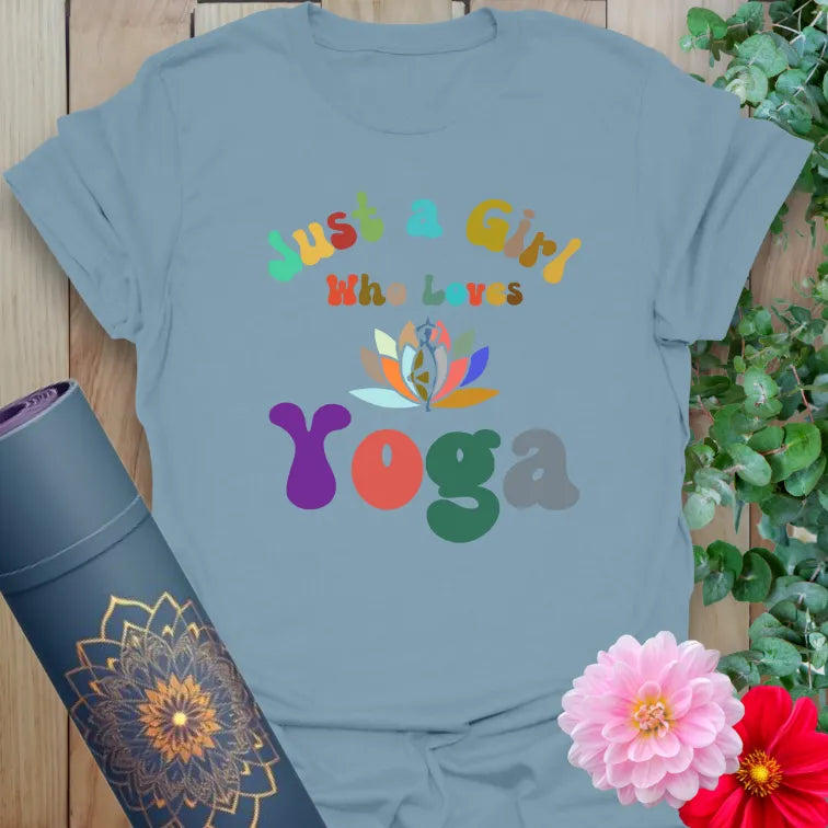 Muted stone blue yoga t-shirt with vibrant "Just a Girl Who Loves Yoga" multicolor design for joyful yoga lovers and free spirits.