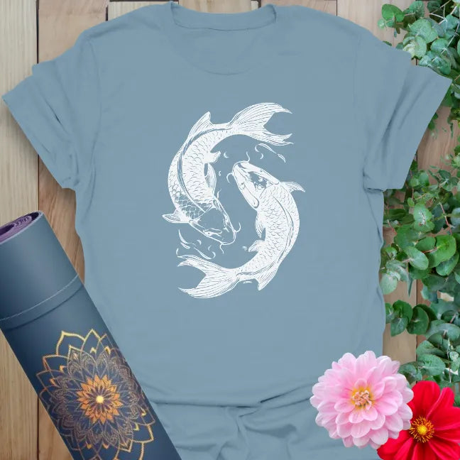 Muted stone blue yoga t-shirt with elegant koi fish yin-yang design perfect for soulful seekers and mindful adventurers.