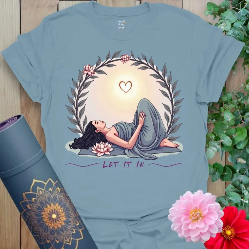Muted stone blue yoga t-shirt with soulful yogi pose and heart-opening sunrise design for grounded, mindful living.
