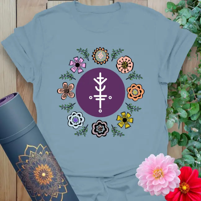 Muted stone blue yoga t-shirt with blooming flower circle and sacred prosperity symbol celebrating joyful, lucky living.