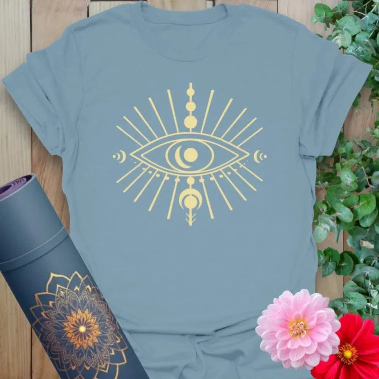 Muted stone blue yoga t-shirt with mystical eye and moon cycle artwork inspiring soulful intuition and cosmic flow.