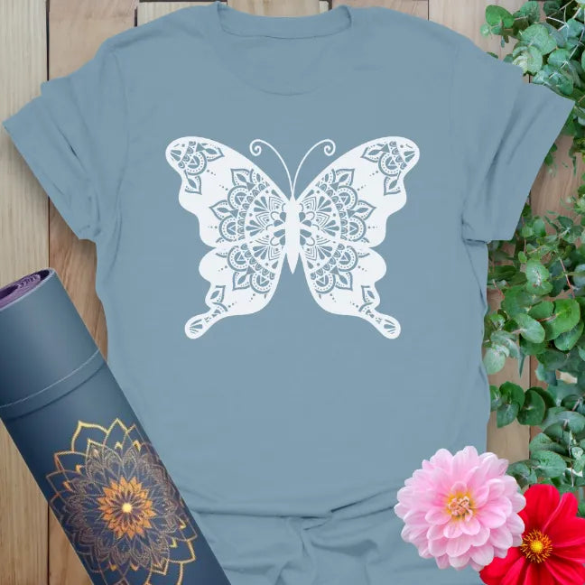 Muted stone blue yoga t-shirt with sacred mandala butterfly design inspiring soulful change and vibrant freedom.