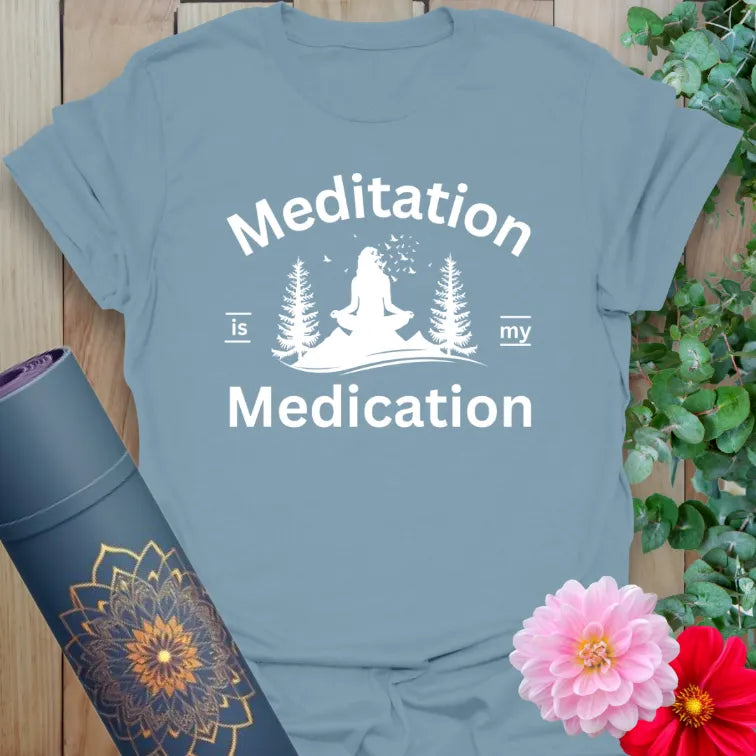 Muted stone blue yoga t-shirt with yogi and nature design symbolizing peaceful healing through mindful meditation.