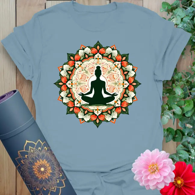 Muted stone blue yoga t-shirt with colorful sacred mandala artwork and meditation figure symbolizing balance, growth, and spiritual beauty.
