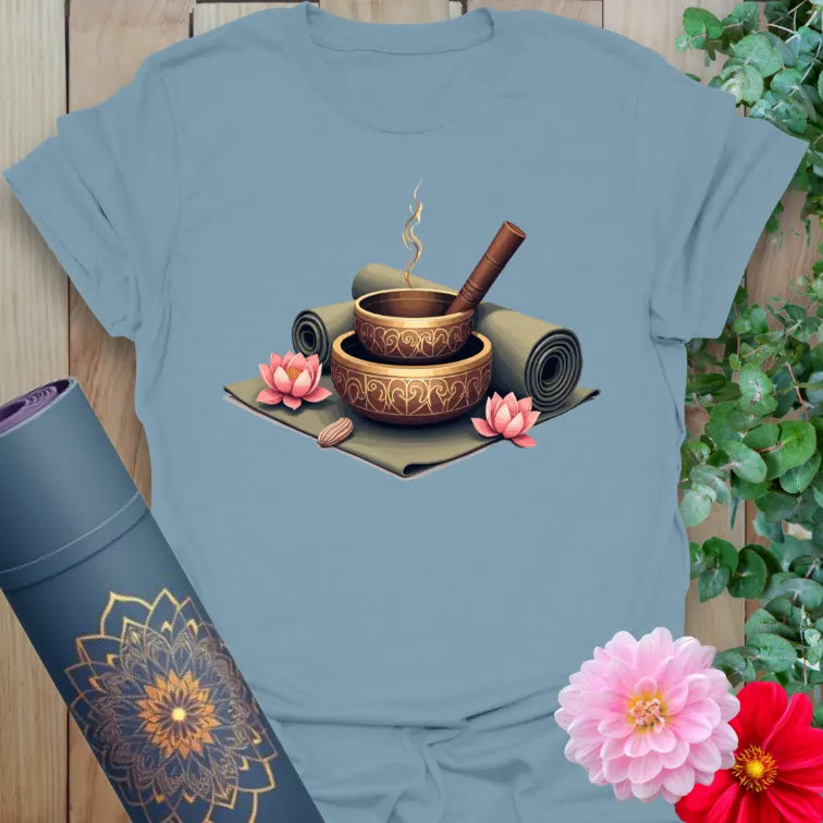 Muted stone blue yoga t-shirt with meditation altar artwork symbolizing soulful balance, healing, and conscious mindfulness.