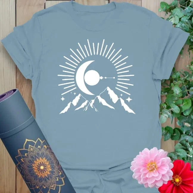 Muted stone blue yoga t-shirt with striking crescent moon, mountains, and starlight artwork inspiring soulful freedom and mindful journeys.
