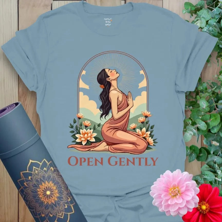 Muted stone blue yoga t-shirt with heart-opening yogi artwork and floral design symbolizing mindful, tender transformation.