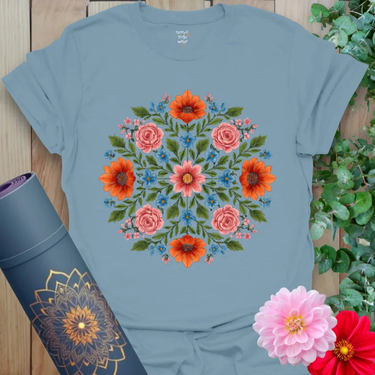 Muted stone blue yoga t-shirt with radiant floral mandala inspiring mindful beauty and soulful everyday movement.