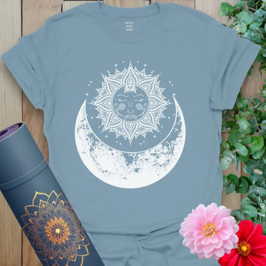 Muted stone blue yoga t-shirt with mystical sun and moon artwork representing growth, flow, and soulful cosmic connection.