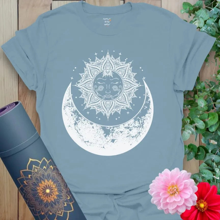 Muted stone blue yoga t-shirt with mystical sun and moon artwork representing growth, flow, and soulful cosmic connection.