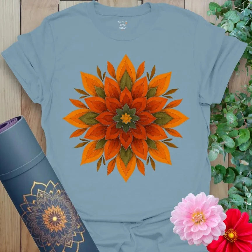 Muted stone blue yoga t-shirt with fiery mandala artwork celebrating soul-centered strength, balance, and joyful movement.