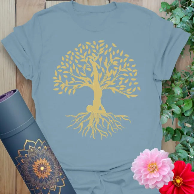 Muted stone blue yoga t-shirt with graceful tree of life design blossoming from yogi pose inspiring soulful strength and conscious expansion.
