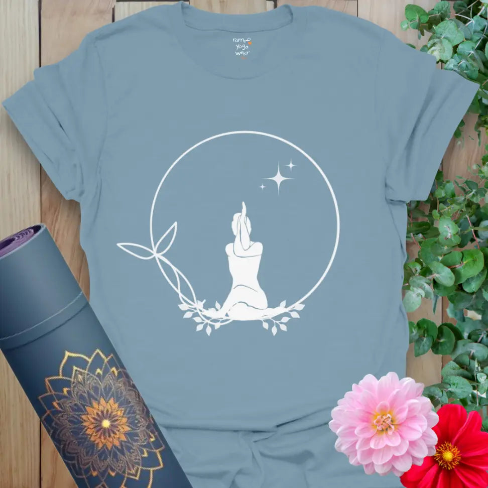 tone Blue Solitude T-Shirt with white meditating silhouette in leafy circle and stars. Everyday yoga tee for peace and mindfulness.