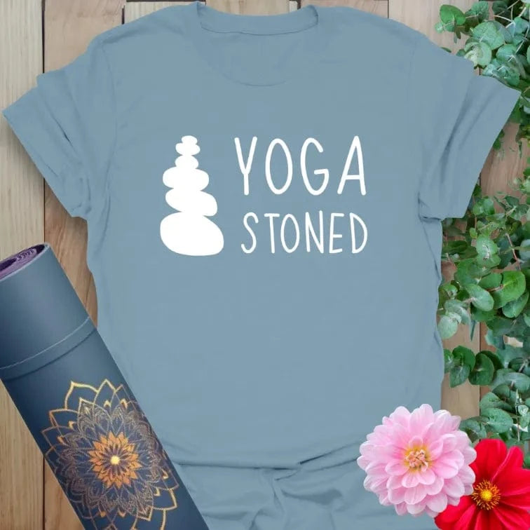 Muted stone blue yoga t-shirt featuring simple stacked stone art and playful lettering for joyful, mindful wear.