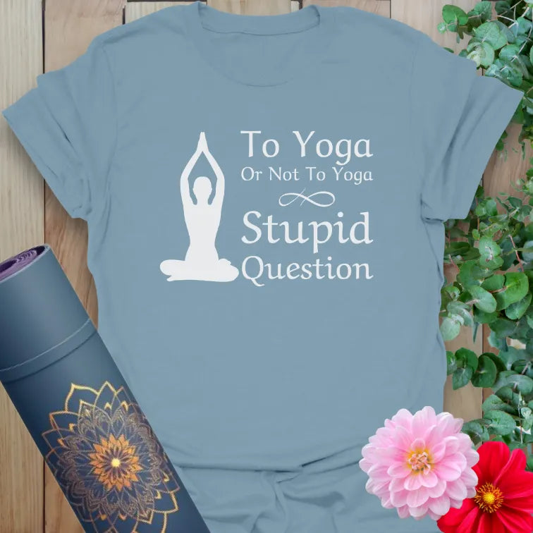Muted stone blue yoga tee with humorous “Stupid Question” quote and yoga pose graphic for cheerful mindful living.