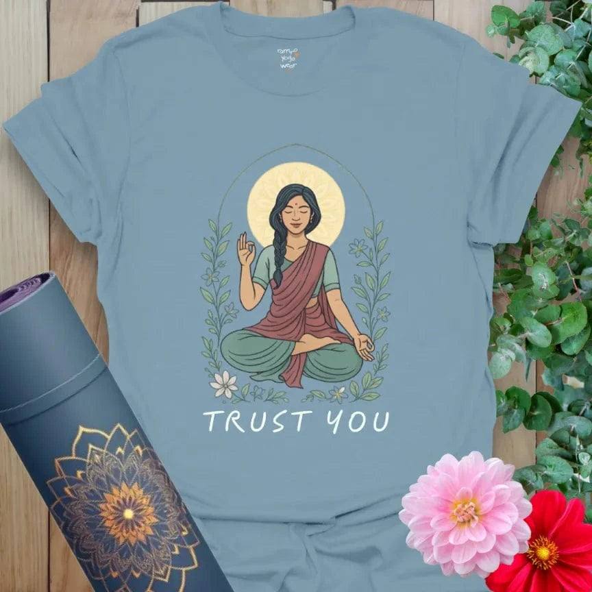 Muted stone blue yoga t-shirt featuring radiant feminine figure and affirmation of self-trust and inner peace.