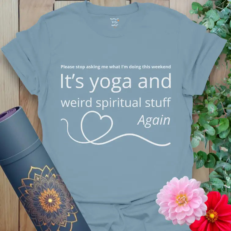 Stone Blue Weird Stuff T-Shirt with the quote “It’s yoga and weird spiritual stuff” in white text. Simple meditating figure design and a heart accent for a touch of humor and calm.