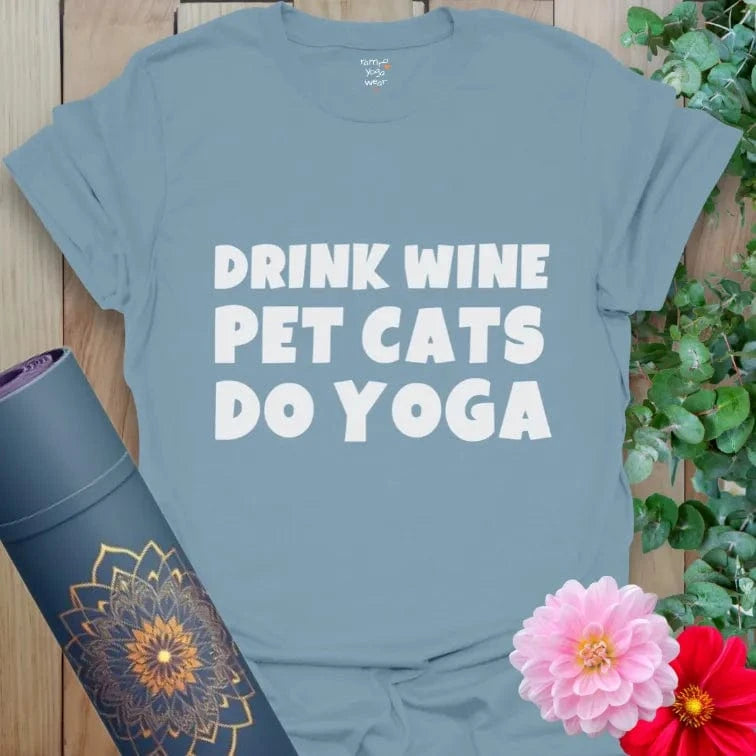 Stone Blue Wine and Cats T-Shirt featuring bold white text design. Soft cotton tee for yogis with a playful side.