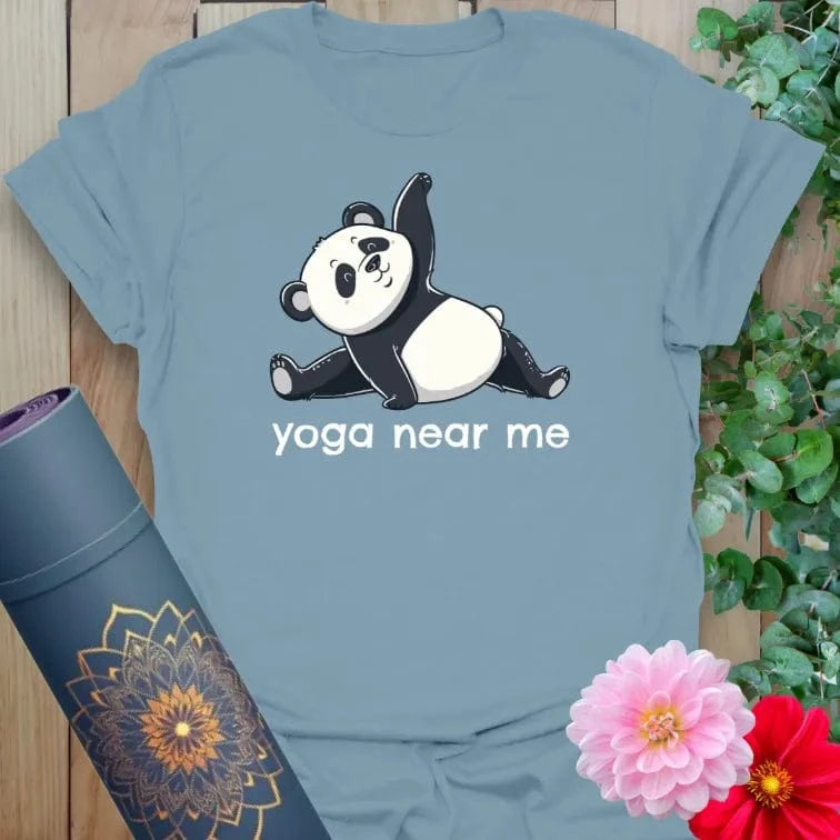 Muted stone blue yoga t-shirt with adorable panda pose and “yoga near me” graphic for joyful yogis.