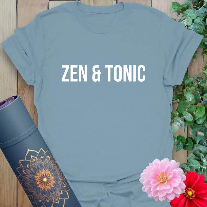 Muted stone blue t-shirt with simple “Zen & Tonic” design for relaxed, spirited yoga expression.