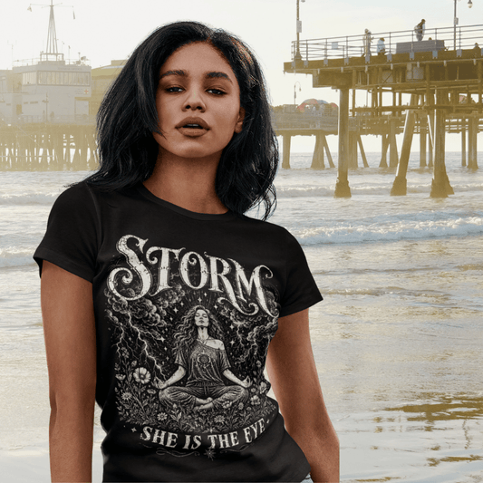 Ramro Yoga Wear Storm tee in Black — woman meditating storm clouds lightning vintage design, beach pier lifestyle shot
