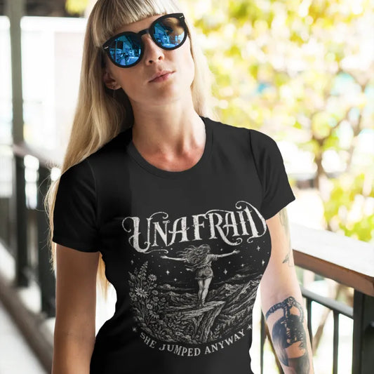 Ramro Yoga Wear Unafraid tee in Black — cliff edge woman wildflowers vintage design, outdoor balcony lifestyle shot