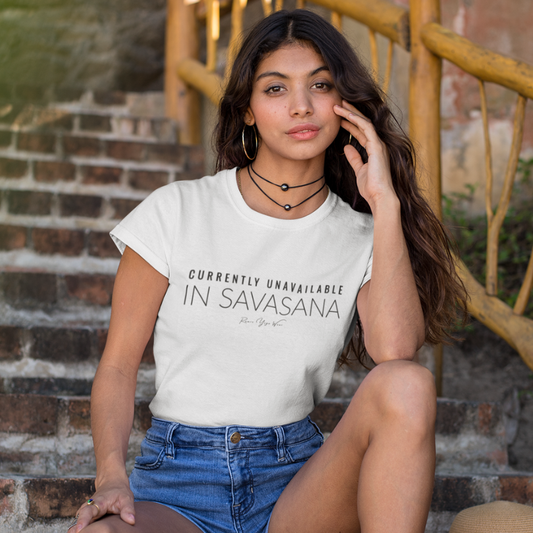 Woman wearing Unavailable White T-Shirt outdoors, sitting on steps — The Vault collection by Ramro Yoga Wear