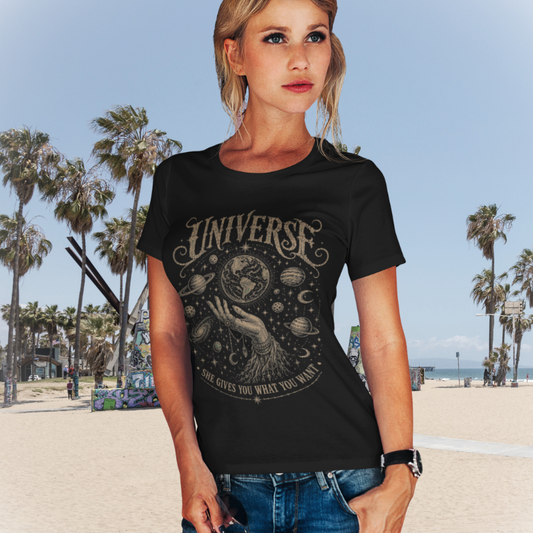 Woman wearing Universe black sacred yoga shirt at the beach with palm trees — Sacred Thread collection by Ramro Yoga Wear