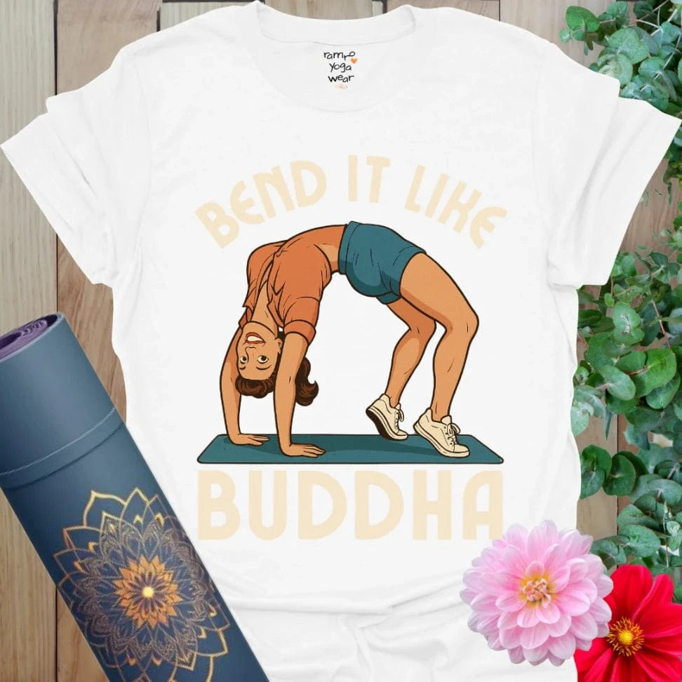 Crisp white yoga tee with playful pinup yogi in backbend and “Bend It Like Buddha” retro-style design.
