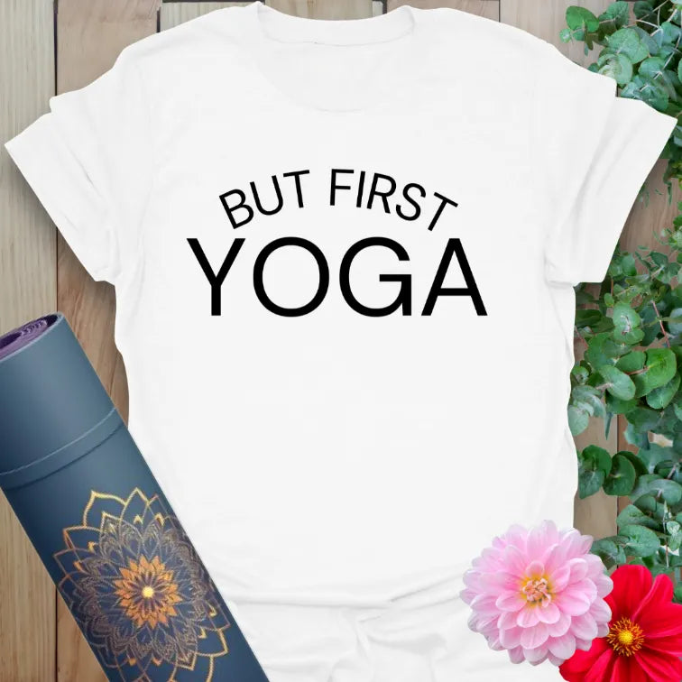 Clean white unisex yoga t-shirt showcasing bold "But First, Yoga" mantra perfect for yogis and mindful movers.