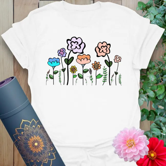 Clean white unisex yoga t-shirt showcasing colorful wildflower artwork for free-spirited, mindful living