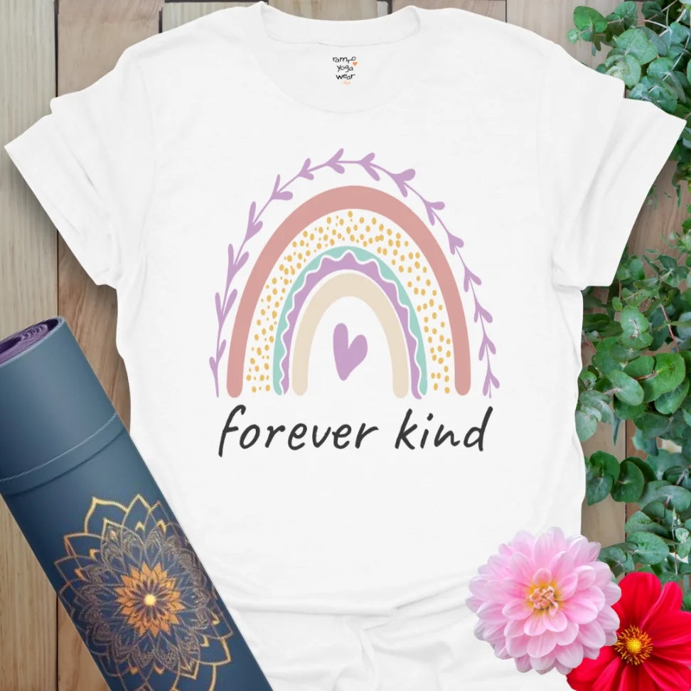Clean white unisex yoga t-shirt showcasing vibrant rainbow and compassion-centered mantra for conscious, kind living.