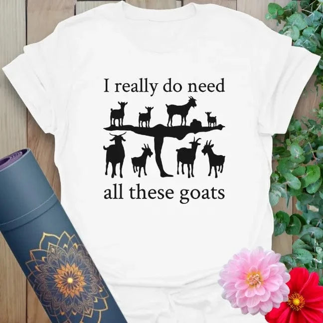 Clean white unisex yoga t-shirt showcasing fun goat yoga illustration and playful quote for soulful, animal-loving adventurers.