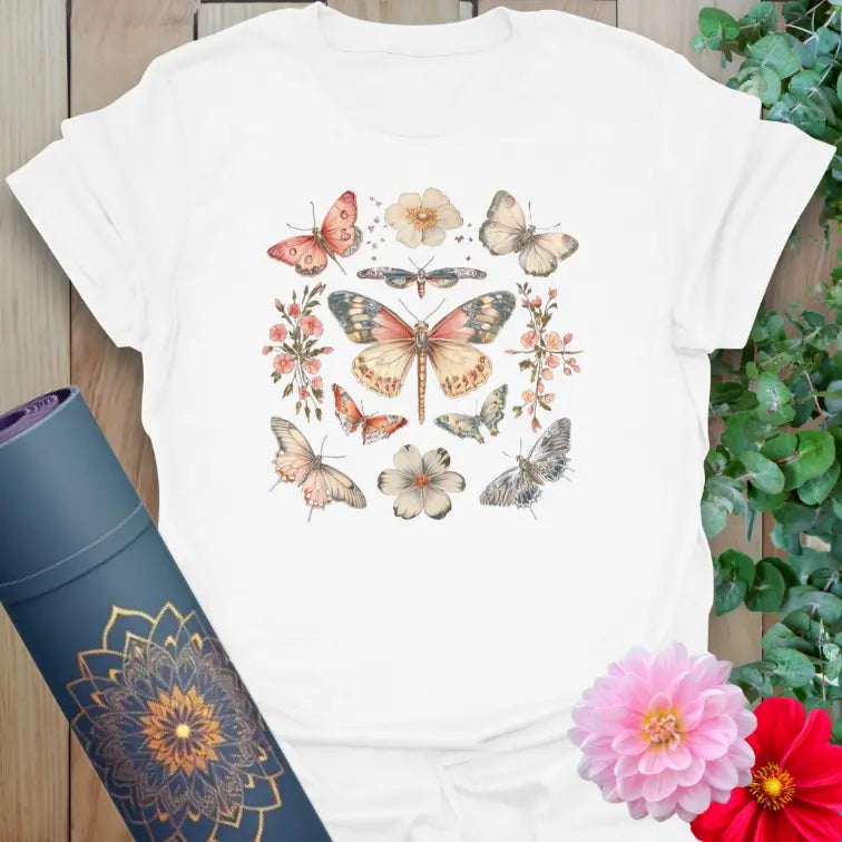 Clean white unisex yoga t-shirt showcasing vibrant butterfly and flower illustration perfect for mindful, conscious living.