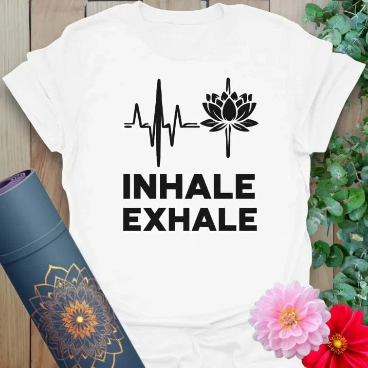 Clean white unisex yoga t-shirt featuring "Inhale Exhale" heartbeat and lotus design for yoga, meditation, and everyday mindfulness.
