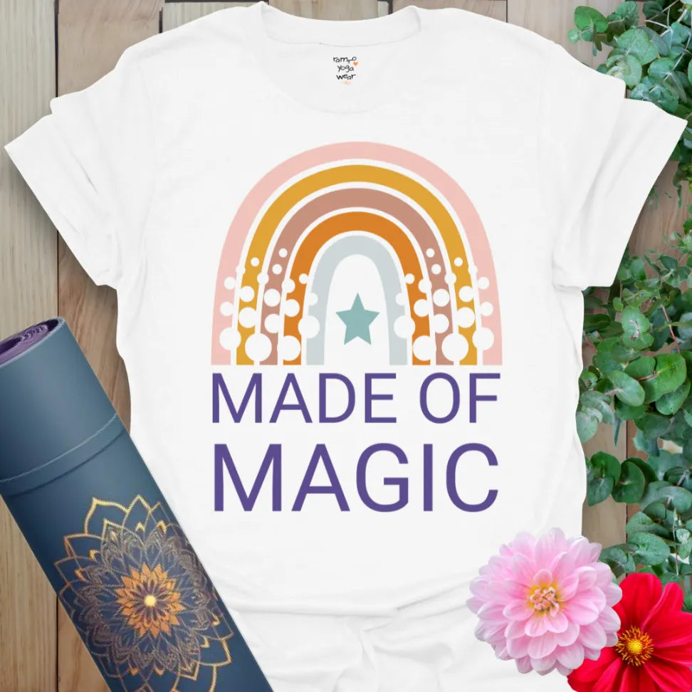 Clean white unisex yoga t-shirt featuring retro rainbow artwork and "Made of Magic" affirmation for heart-led, joyful living.