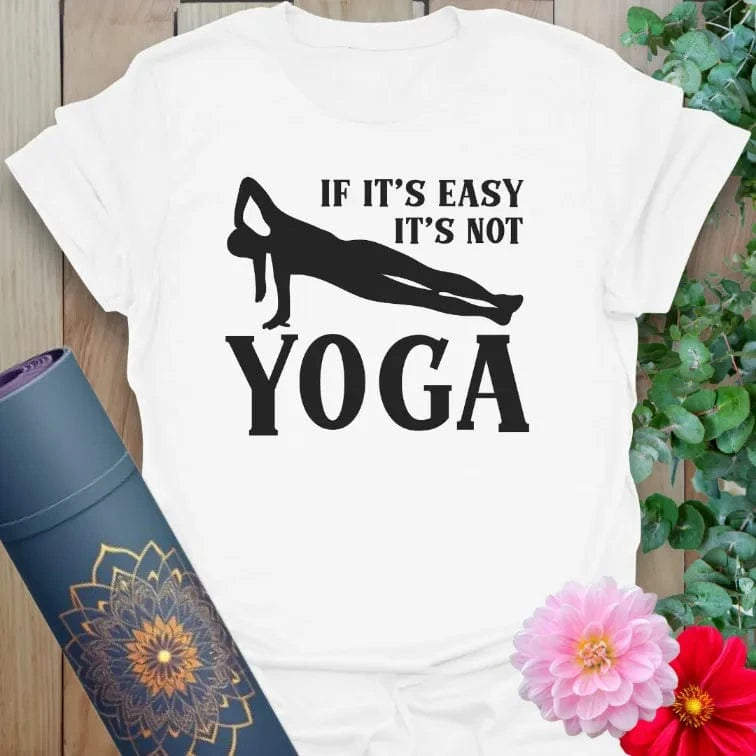 Clean white unisex yoga t-shirt featuring playful "Not Easy" yoga quote inspiring strong, conscious, joyful living.