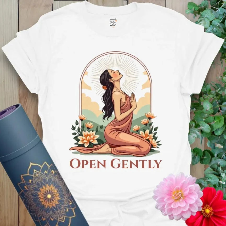 Clean white unisex yoga t-shirt featuring uplifting heart-opener pose and vibrant garden setting for soulful, conscious living.